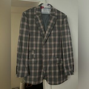 This is a 3 piece Tiglio suit. The suit consist of a jacket, pants and vest.